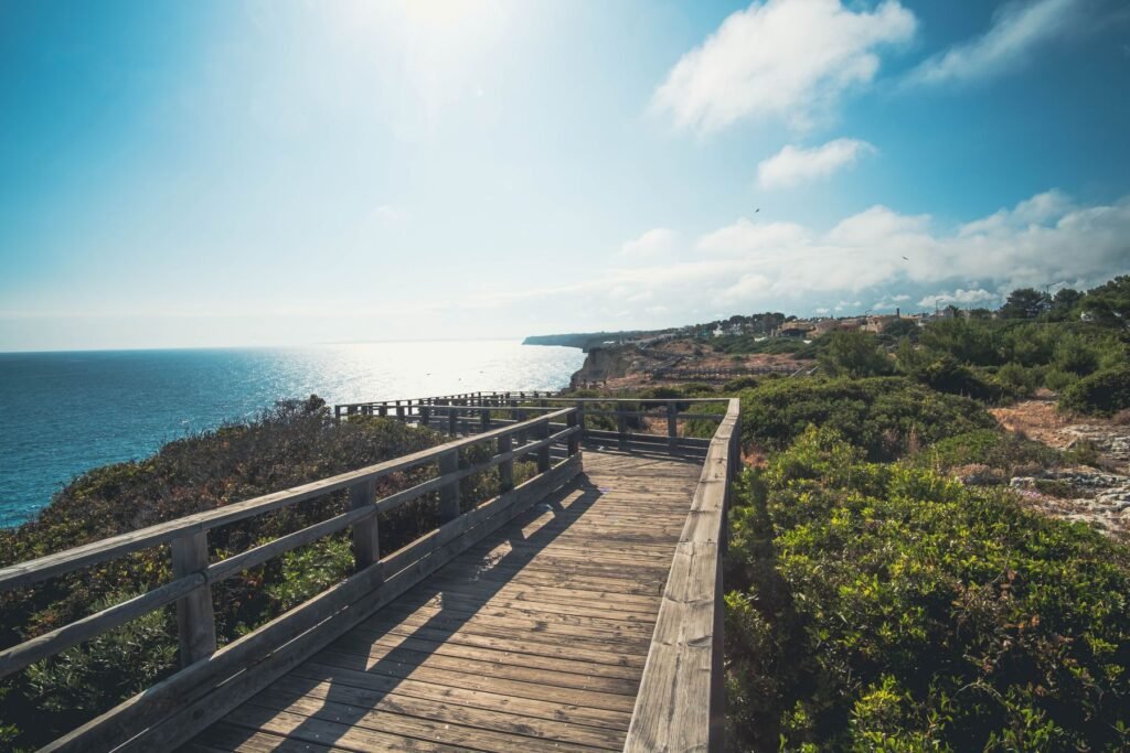 Wooden boardwalk along the Algarve coastline