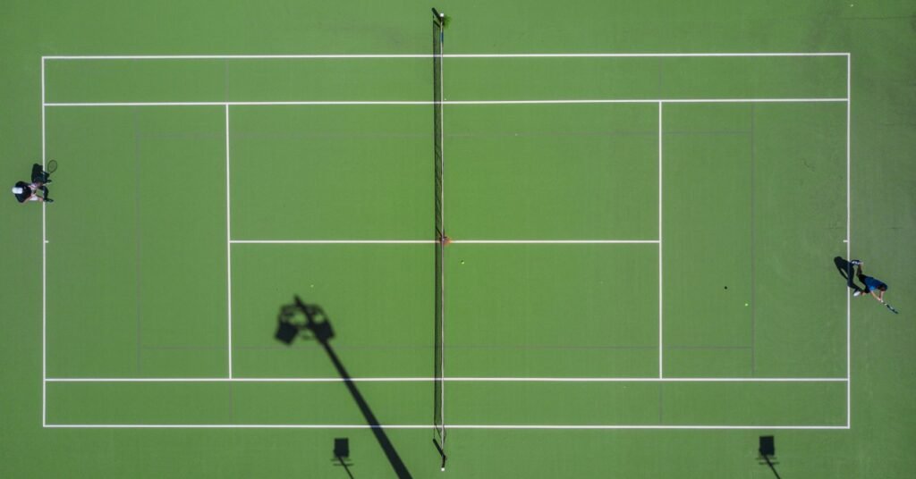 Two tennis players on a bright outdoor court